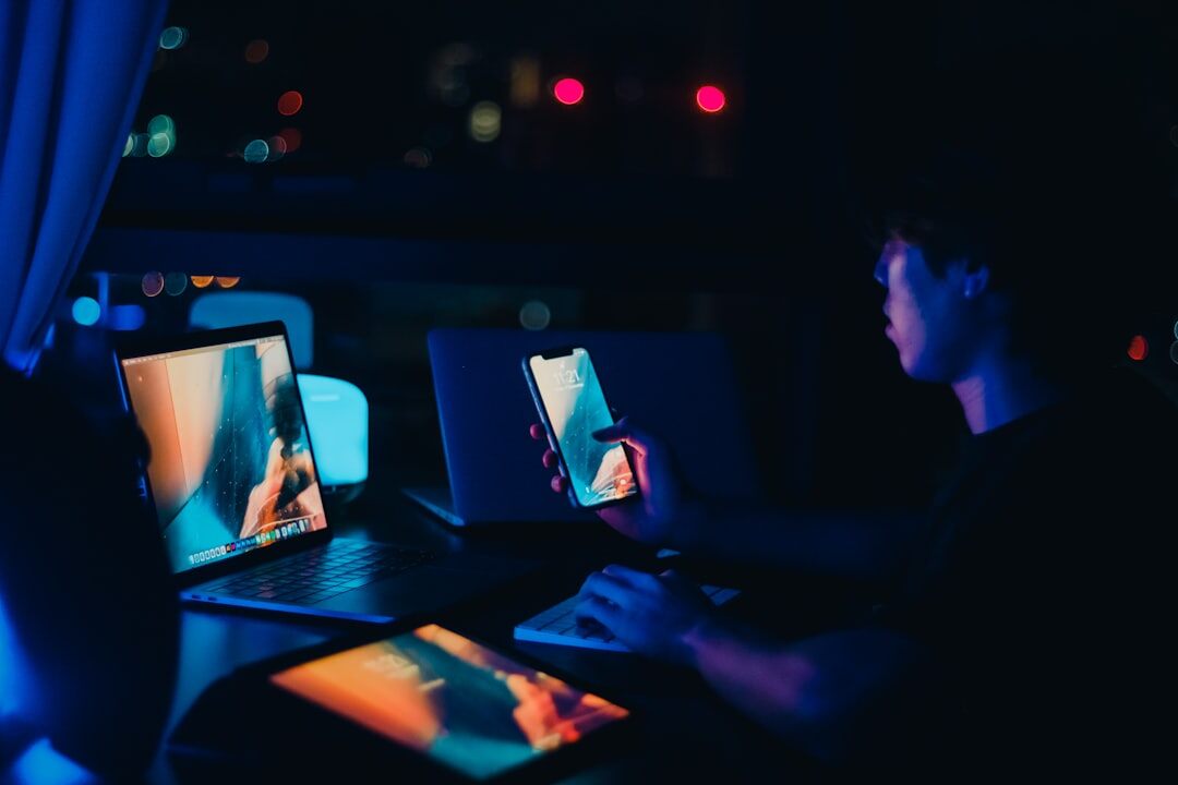 Journalist analyzing media trends on multiple screens